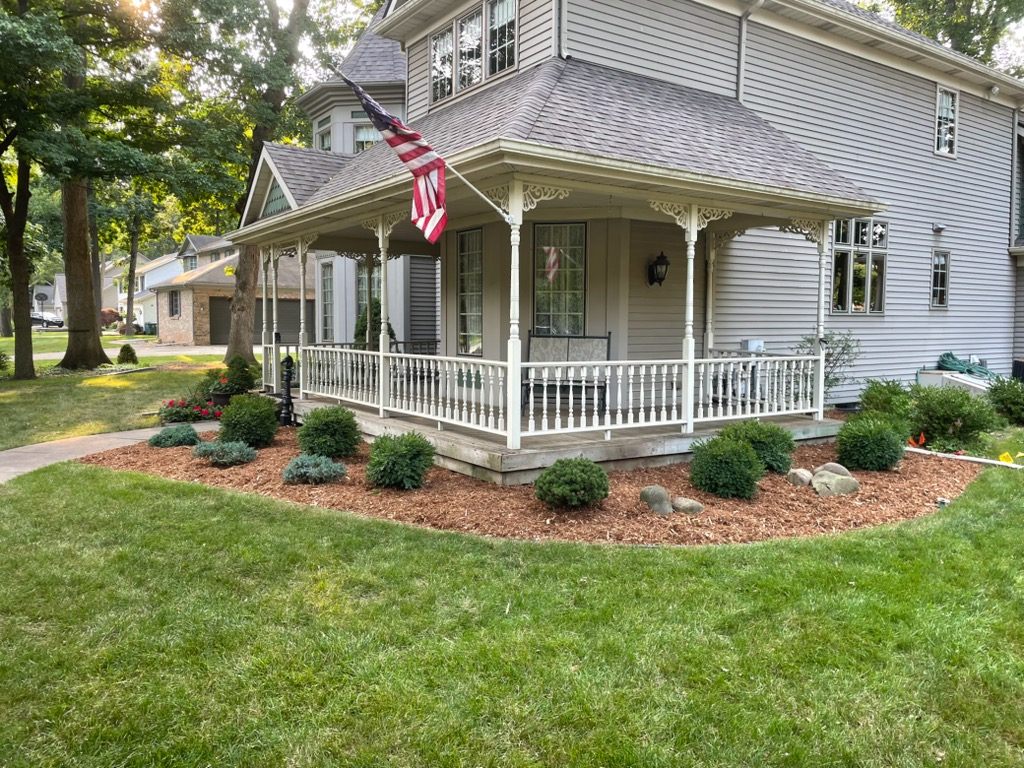 Well-maintained mulched landscape bed