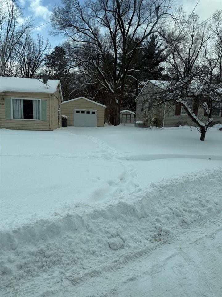 Cleared residential driveway after a storm